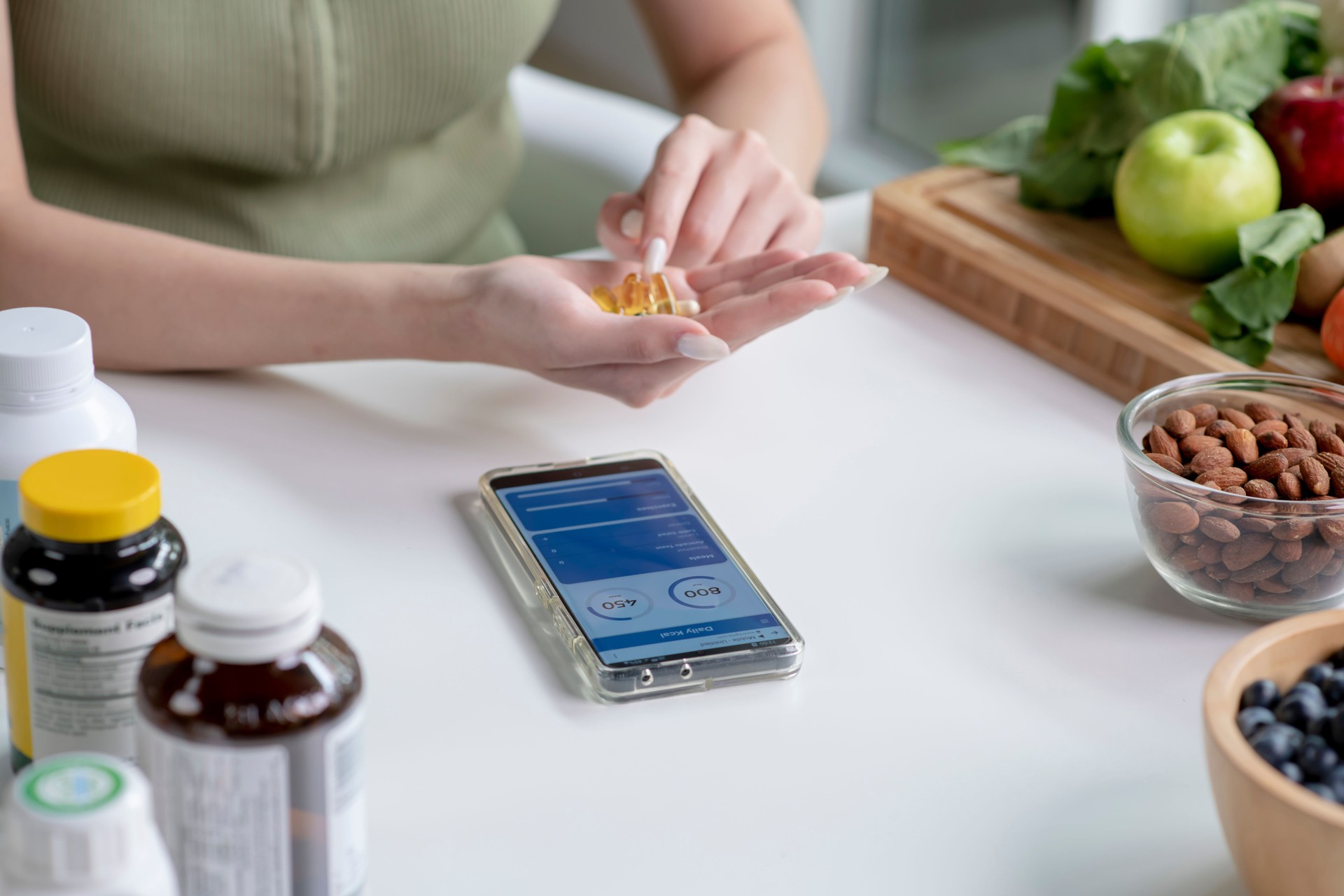 Nutritionist checking dietary supplements in hand